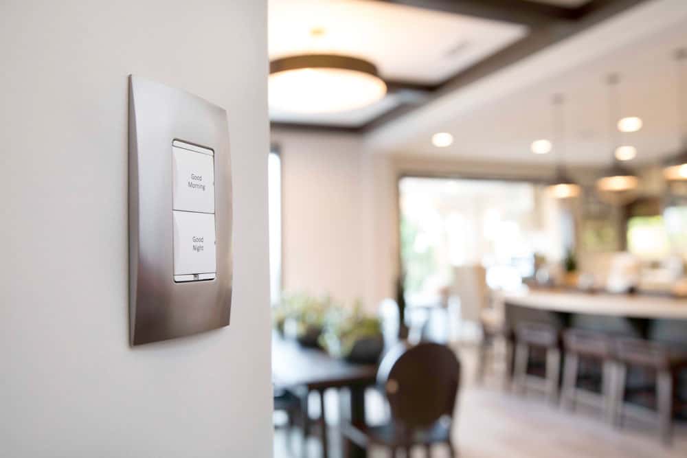 A lighting control switch on a wall in a home.